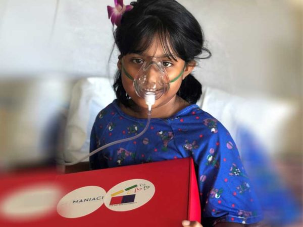 Patient in a Children's Hospital holding an Art Box