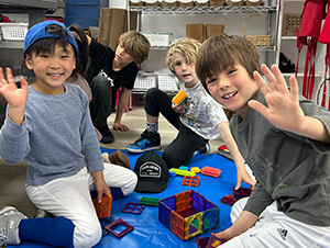 Four Kids Waving Hello at the Art Box Academy